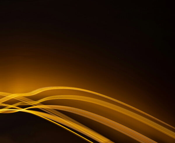 black background with glowing gold lines coming through the bottom