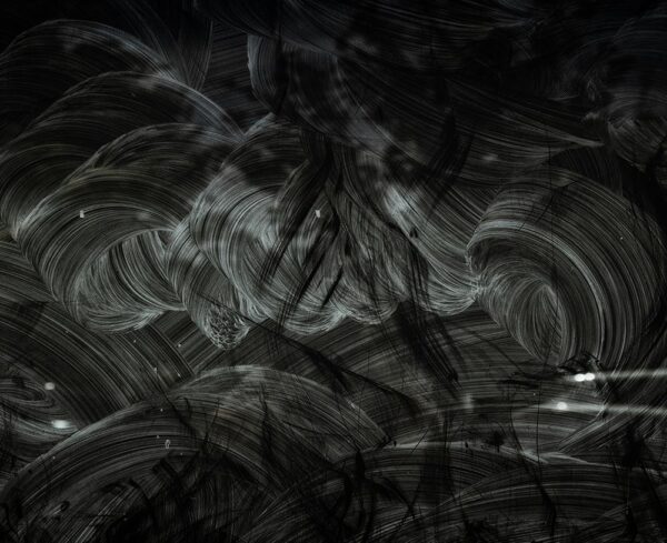 black chalkboard with chalk eraser circular motions