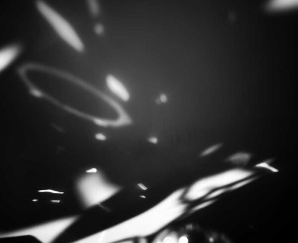 an abstract gray background image with lightleaks in different shapes