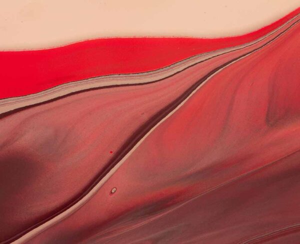 close up red texture with swirls of dark and light browns