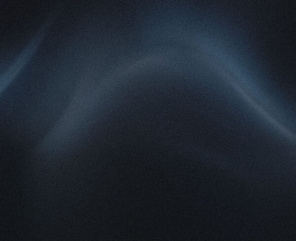 blue grainy wave image with dark feel of almost a flowing wave