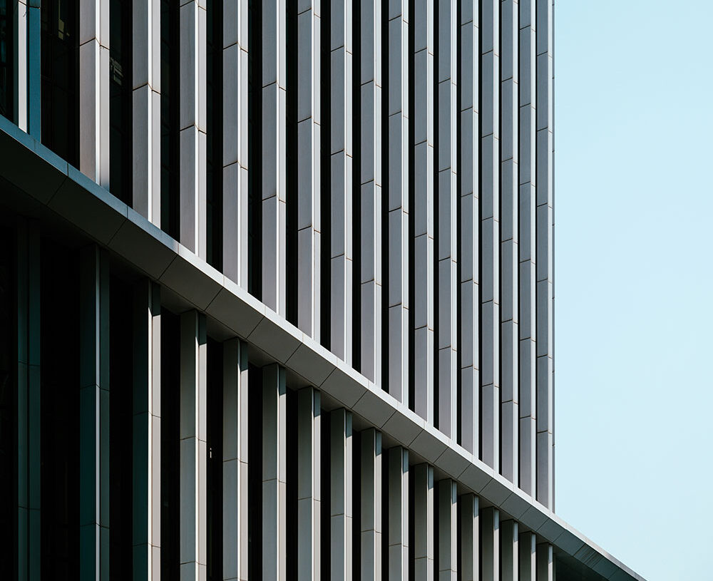the side of a building outside abstract with clear blue skies