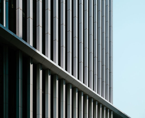 the side of a building outside abstract with clear blue skies