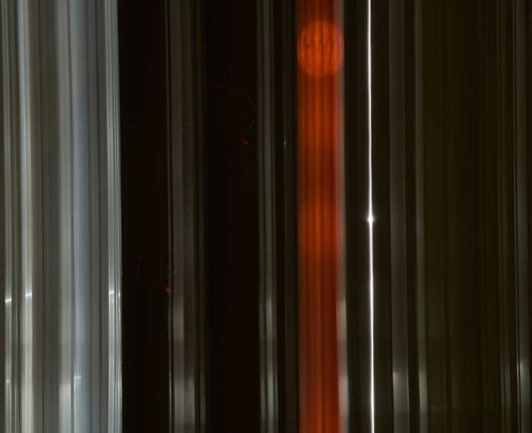 light leaks and lines going vertically with red towards the middle of the image