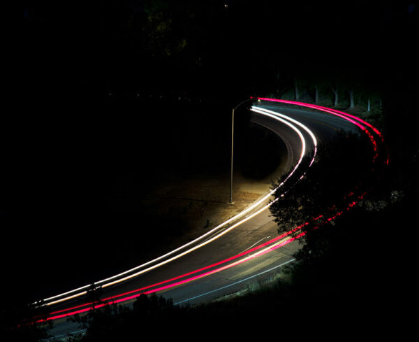 lights on winding road illustrating car movement