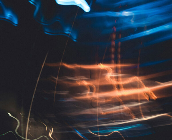 a blurry image of what looks like a car and lights
