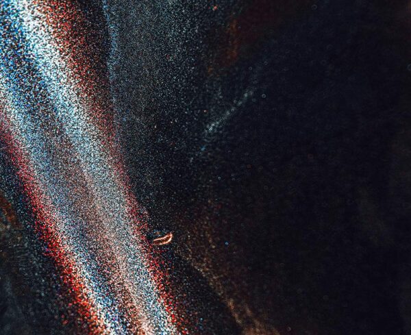 textured surface with black on the right and rainbow structure on left, ITC investigations