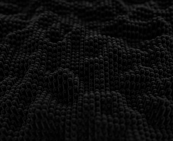 Very dark background with light gray rounded bits