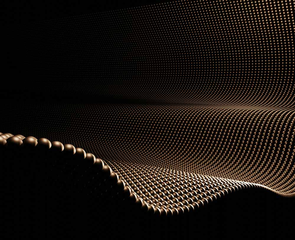 black and gold spheres linked together creating a wavy sheet