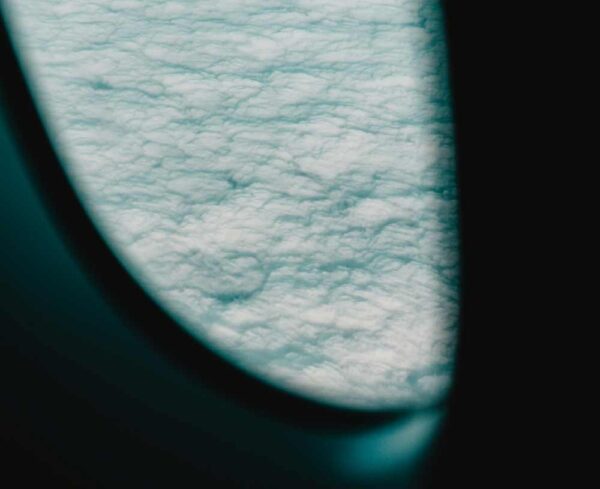 Looking at clouds outside of plane window