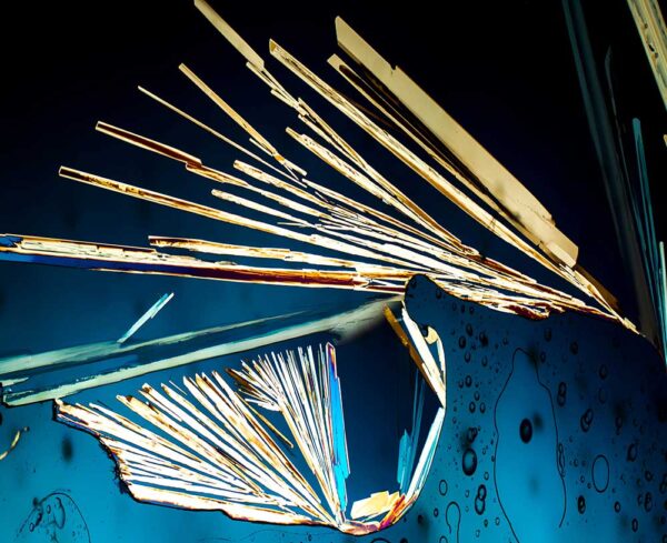 what looks like a broken window with rainbow shards and lines stemming from break