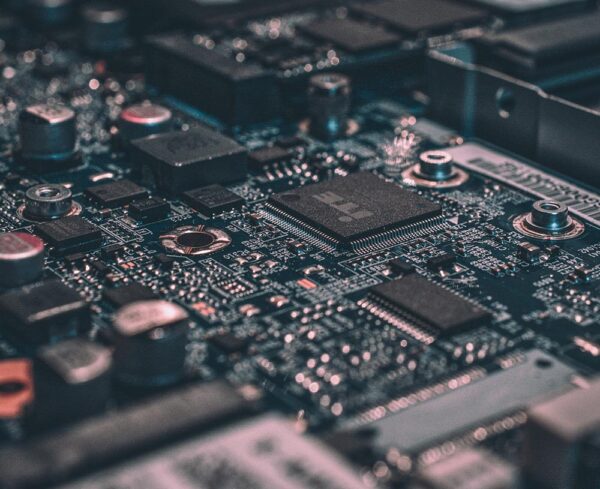 slightly blurred, printed circuit board (PCB) with cool tones