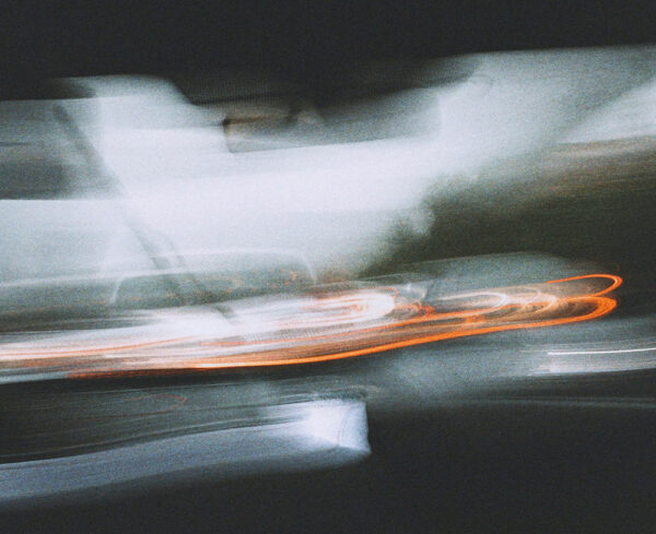 view from passenger seat of vehicle through windshield, tail light motion