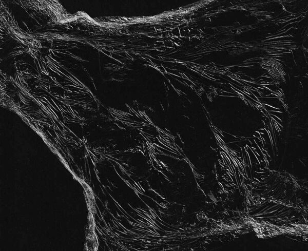 black background with clear plastic wrap laying over it