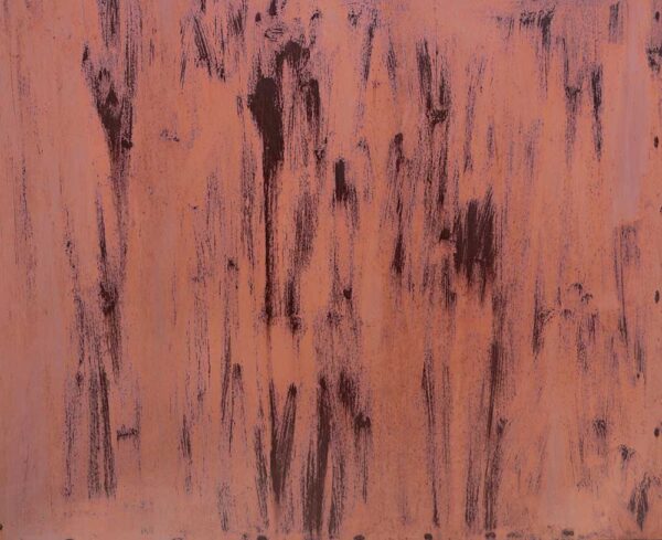 A rusty copper colored surface with worn areas