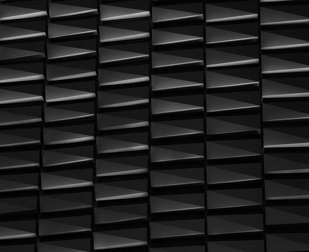 a triangle pattern with dark shadows showing texture