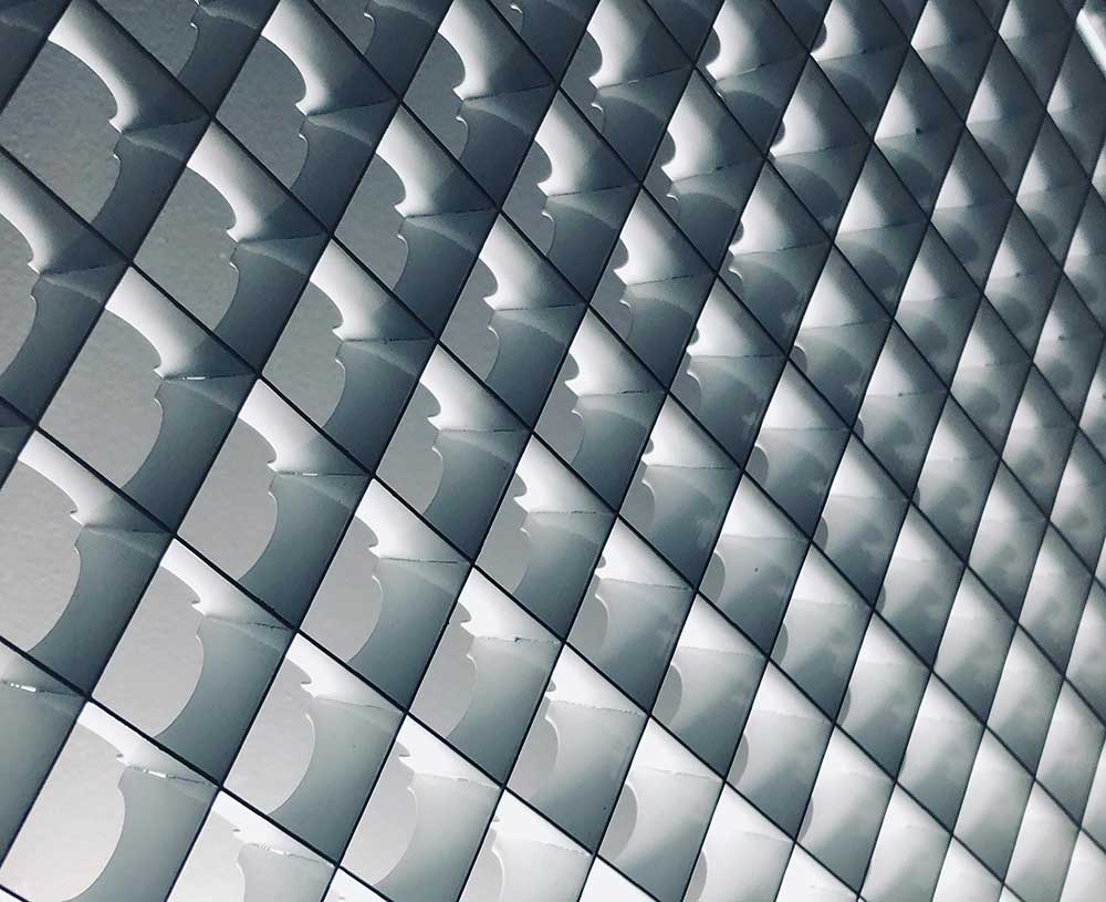 looking up at a ceiling that are illuminated squares