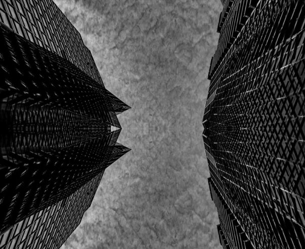 black and white looking up at building from ground