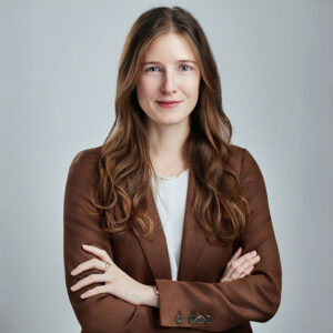 Eleanor Hamilton looking head on at the camera with her arms crossed.
