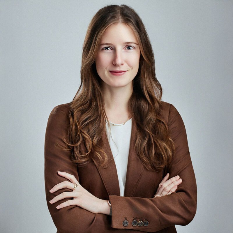 Eleanor Hamilton looking head on at the camera with her arms crossed.