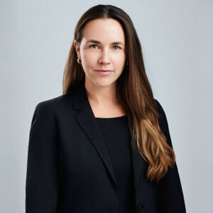 Maria Obregon looking straight into the camera with arms at the sides.