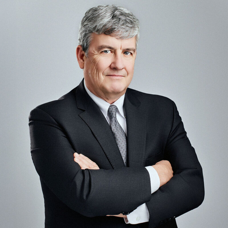 Peter Fitzgerald looking into the camera angled slightly to the right with arms folded.