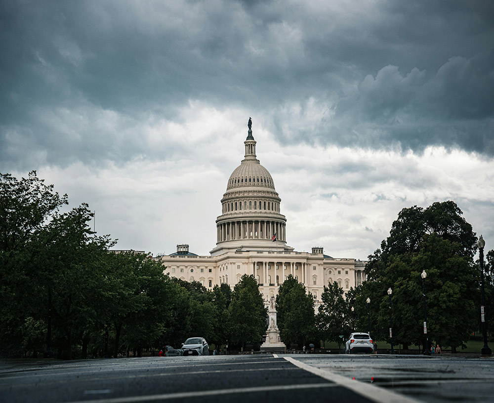look at DC with dark ominous clouds looming over government building