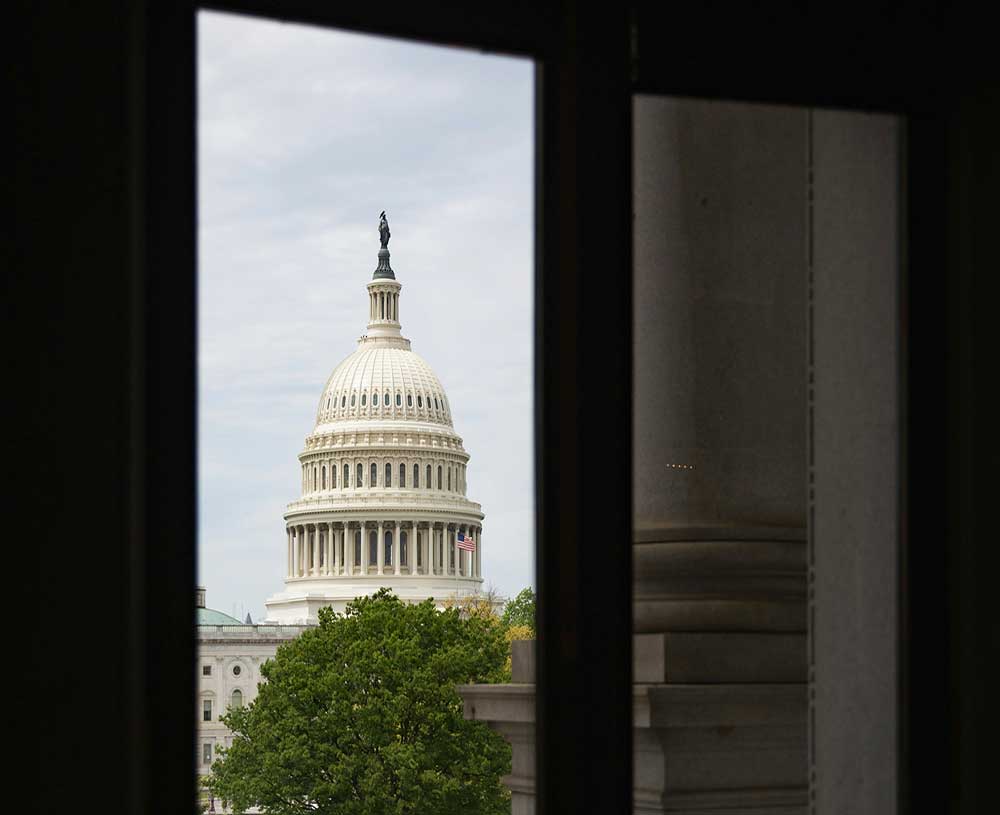 looking at the capitol building through a window in DC