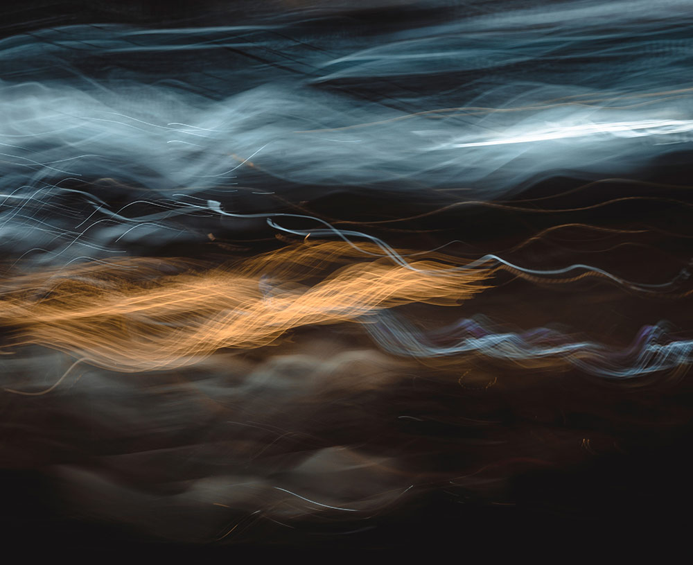 white and copper lines indicating movement on a black background